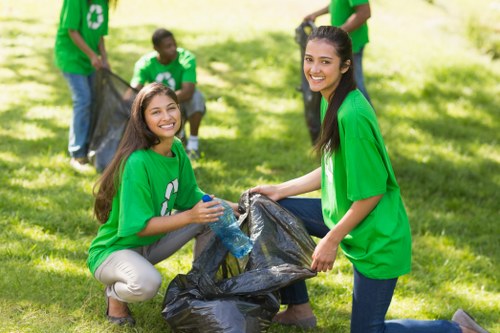 Friendly garden clearance professionals assisting homeowners